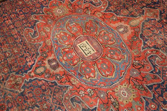 An antique Malayer carpet, dated 1905, 14ft 3in by 10ft 4in.